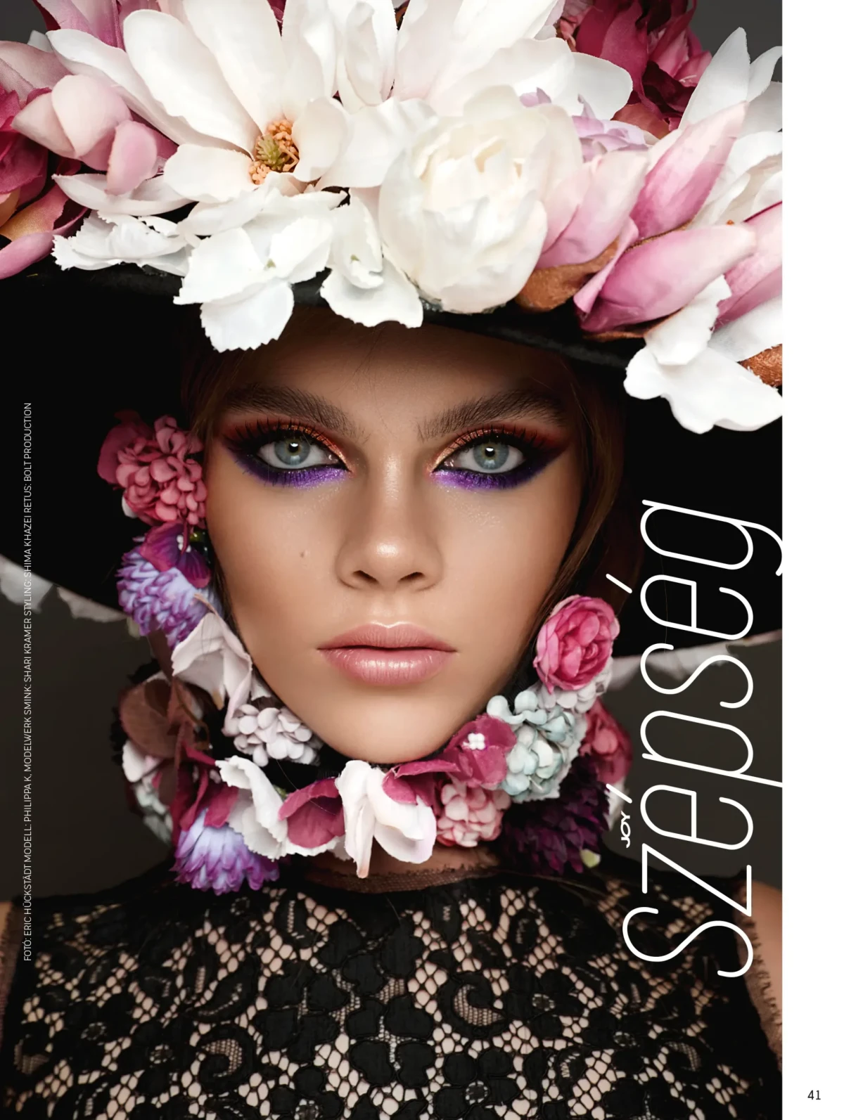 Beauty portrait with pink and white flower headpiece and vivid eye makeup