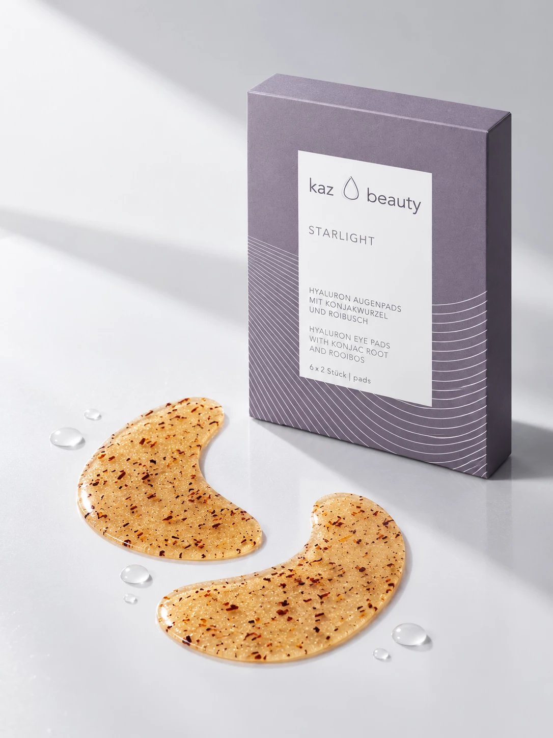KAZ Beauty Starlight eye-pad packaging with golden eye pads and water droplets