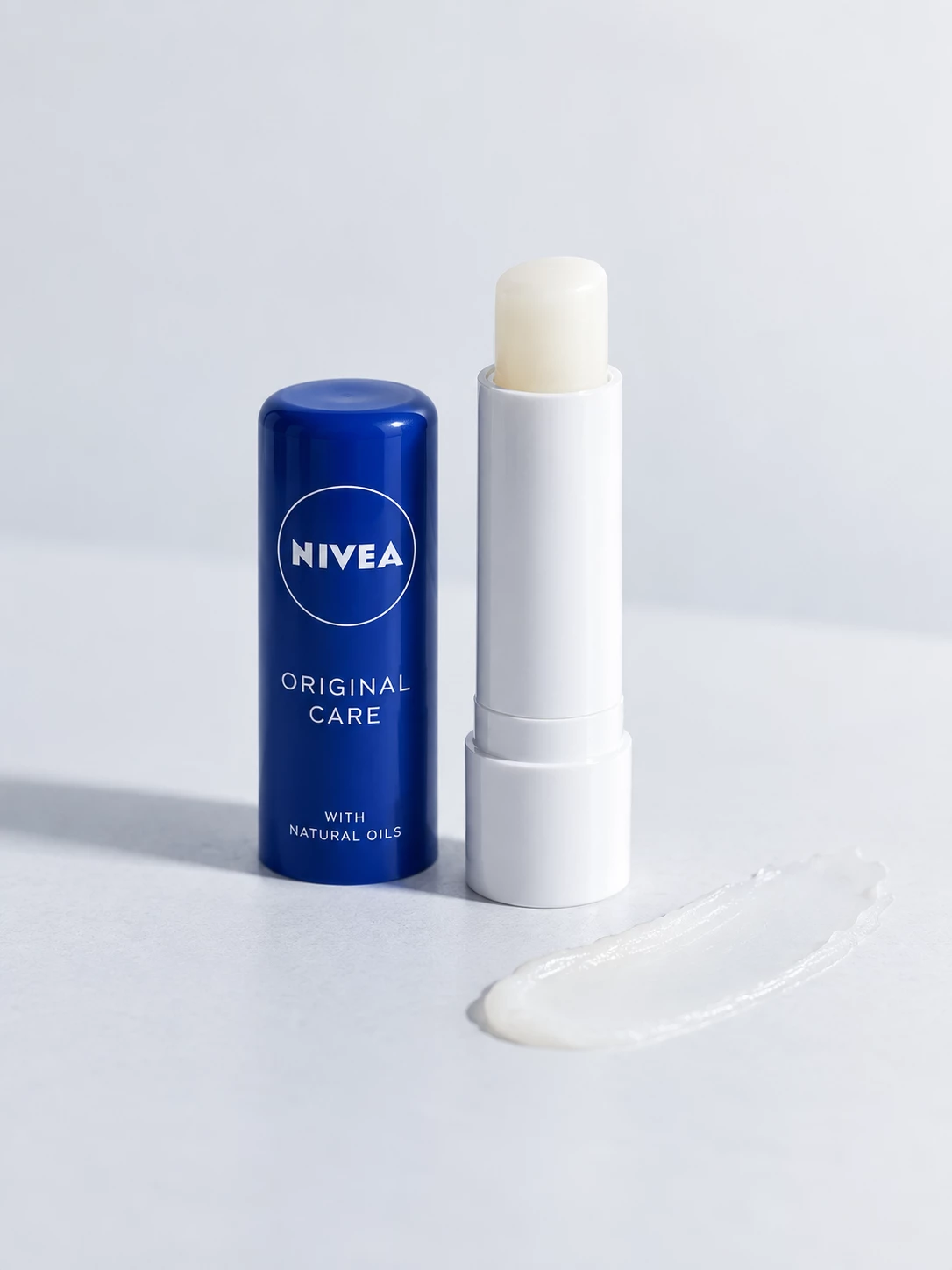 Nivea Original Care lip balm with blue cap and translucent smear