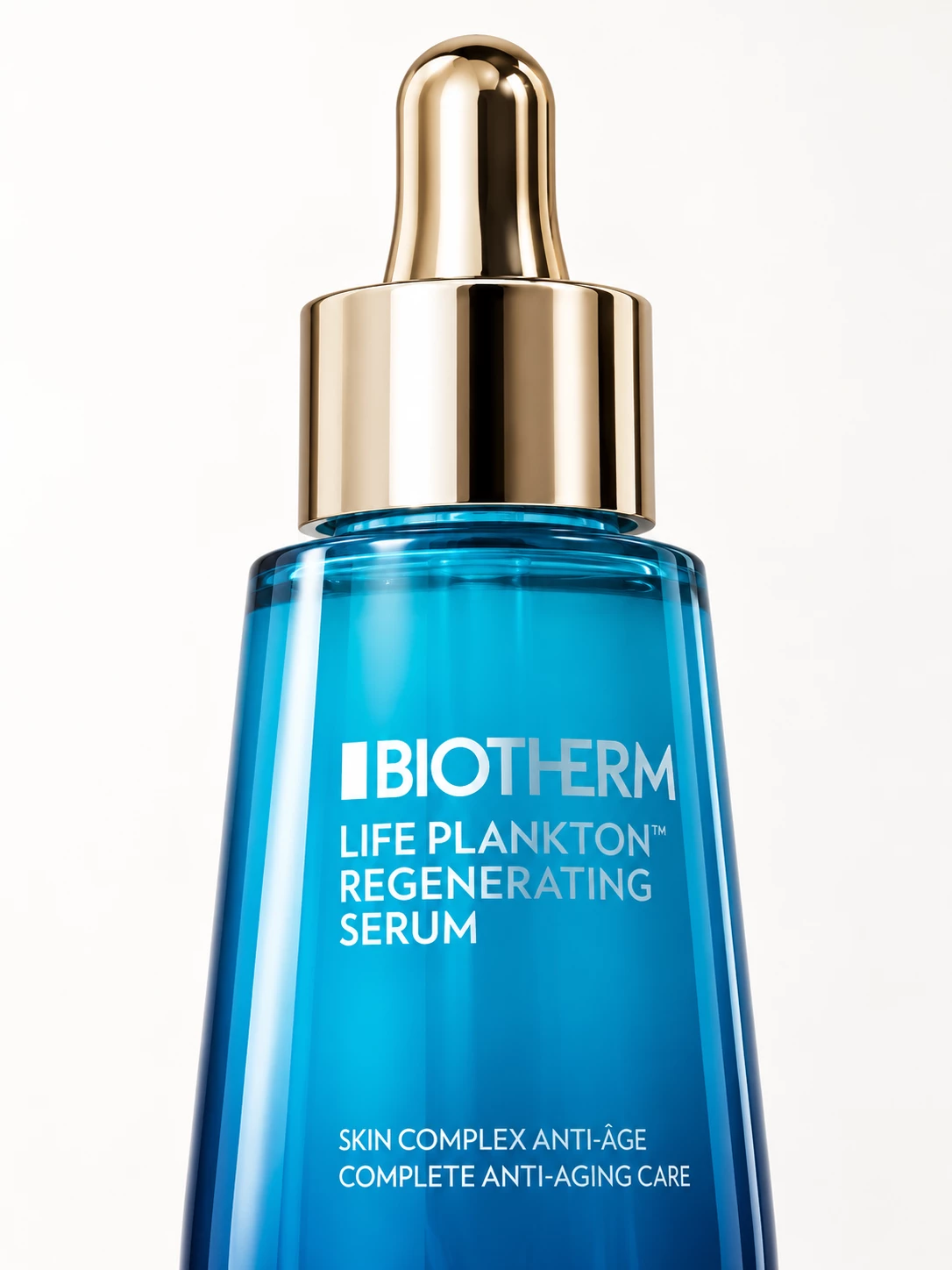 Close-up of the gold dropper and blue Biotherm serum bottle